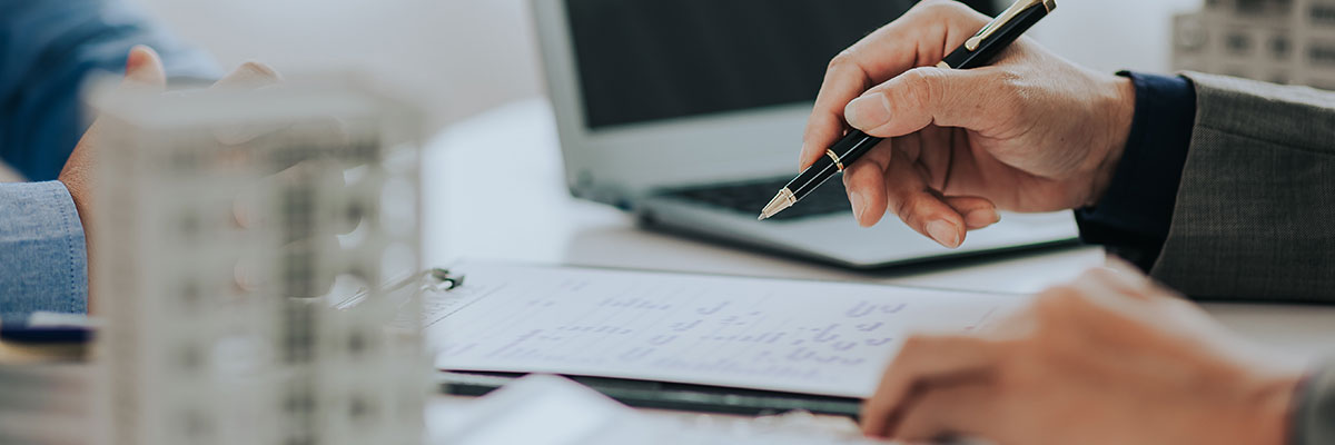 Repossession of a Commercial Property - Picture of a person writing notes on a notepad.