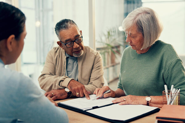 Enduring Power of Attorney - Picture of a couple reviewing and signing their Enduring Power of Attorney.