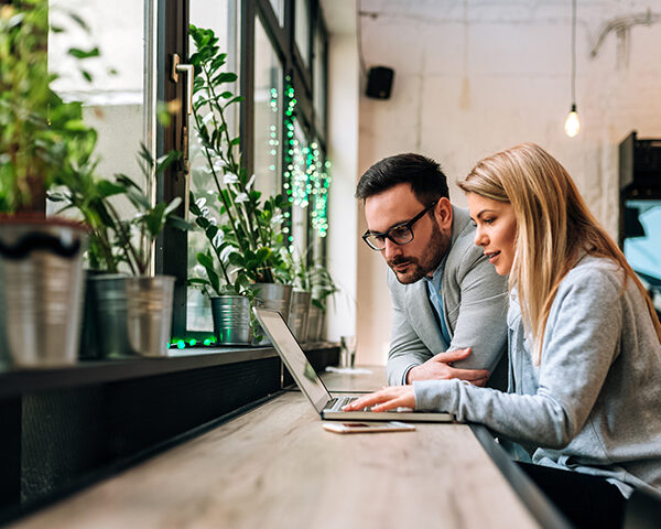 Partnership Agreement Lawyers - Picture of a lady reviewing a Partnership Agreement with their business partner.