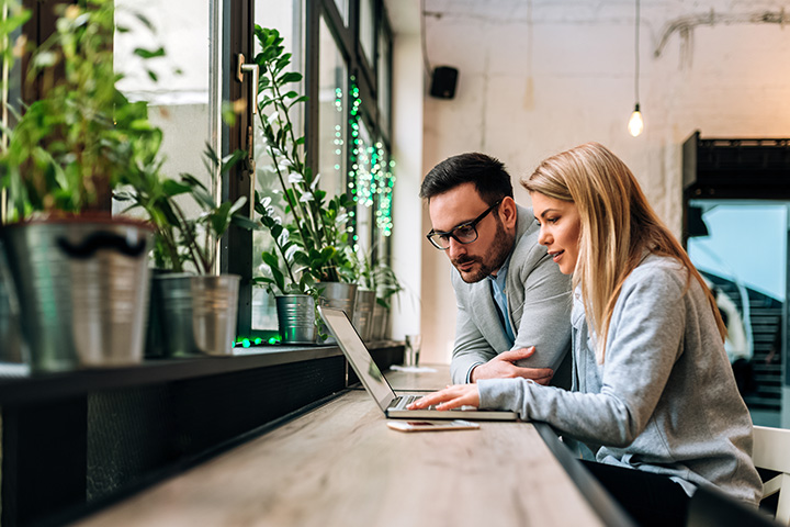 Partnership Agreement Lawyers - Picture of a lady reviewing a Partnership Agreement with their business partner.