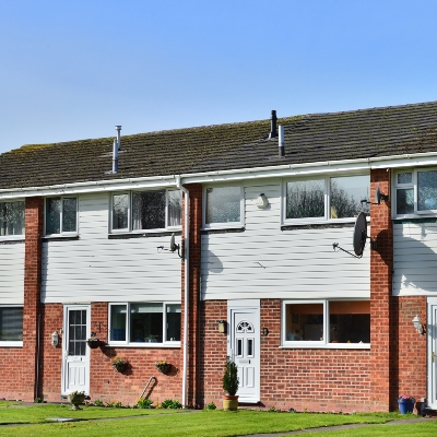HSR Law Solicitors - Right to Buy Scheme - Picture of a row of council houses UK - Feature Image