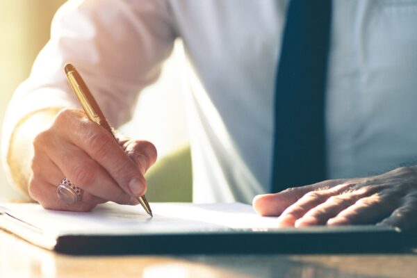 HSR Law - Grant of Probate Solicitors - Picture of a professional signing a document - Feature