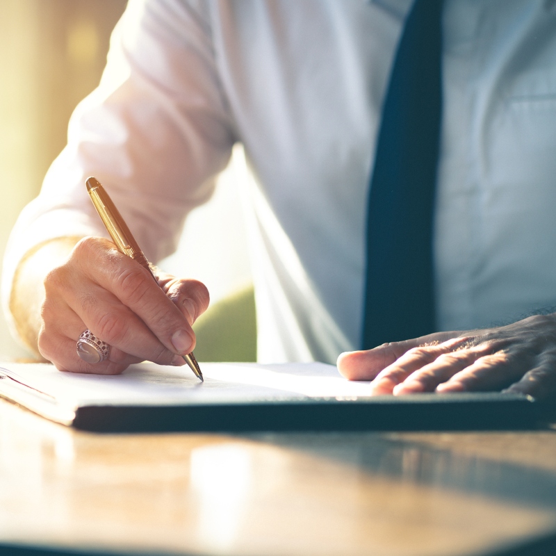 HSR Law - Grant of Probate Solicitors - Picture of a professional signing a document - Feature